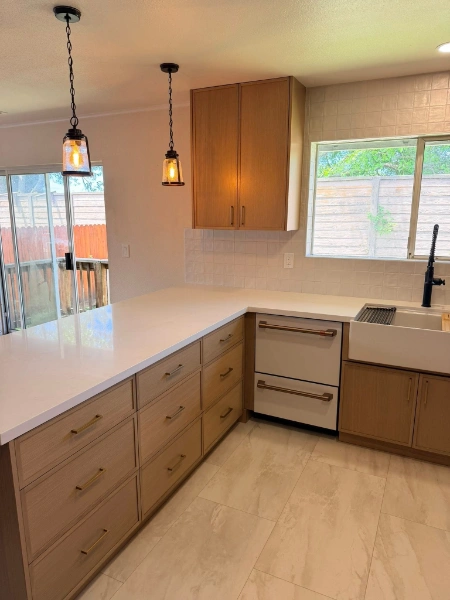 Full-height porcelain slab backsplash floor to ceiling in Heritage Hills Grand Rapids kitchen